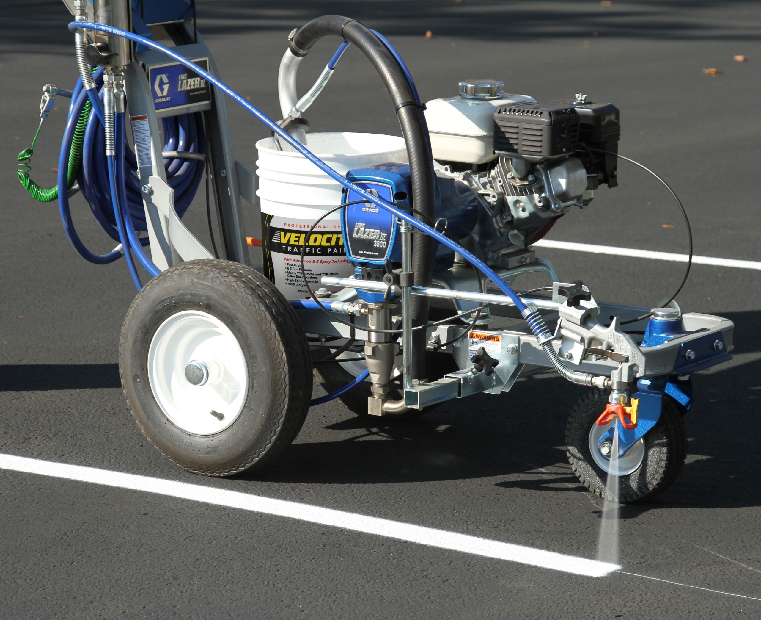 Applying SealMaster Velocity Traffic Paint. Traffic Marking Paint for Parking Lots, Roads and More.
