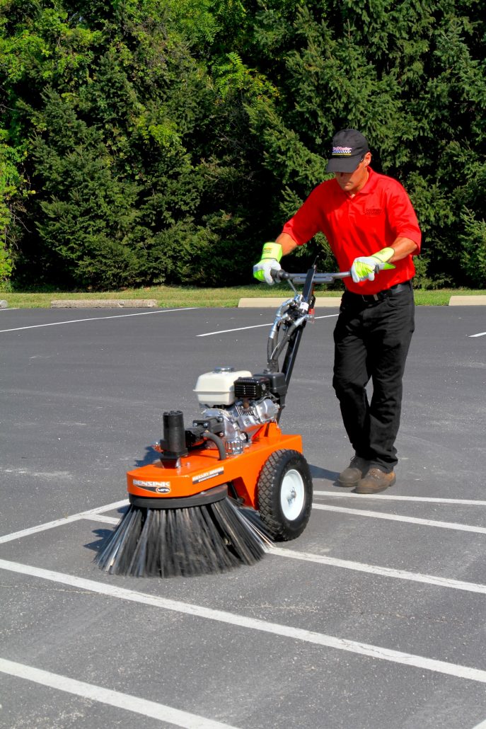 Cleaning and preparing the parking lot with a rotary broom before applying sealcoat and traffic marking paint. Learn how to stripe a parking lot.