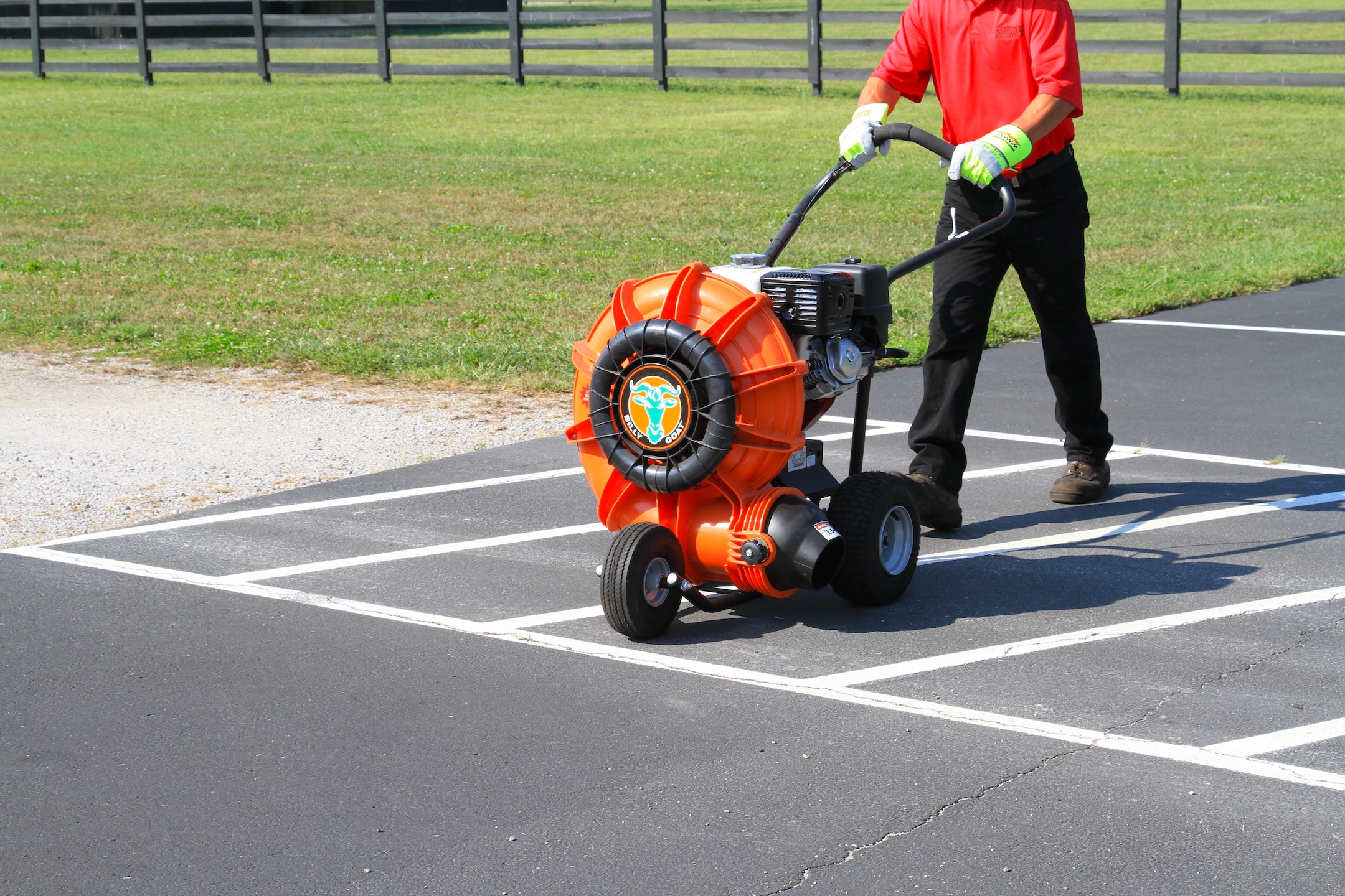 Cleaning and preparing the parking lot with a blower before applying sealcoat and traffic marking paint. Learn how to stripe a parking lot.