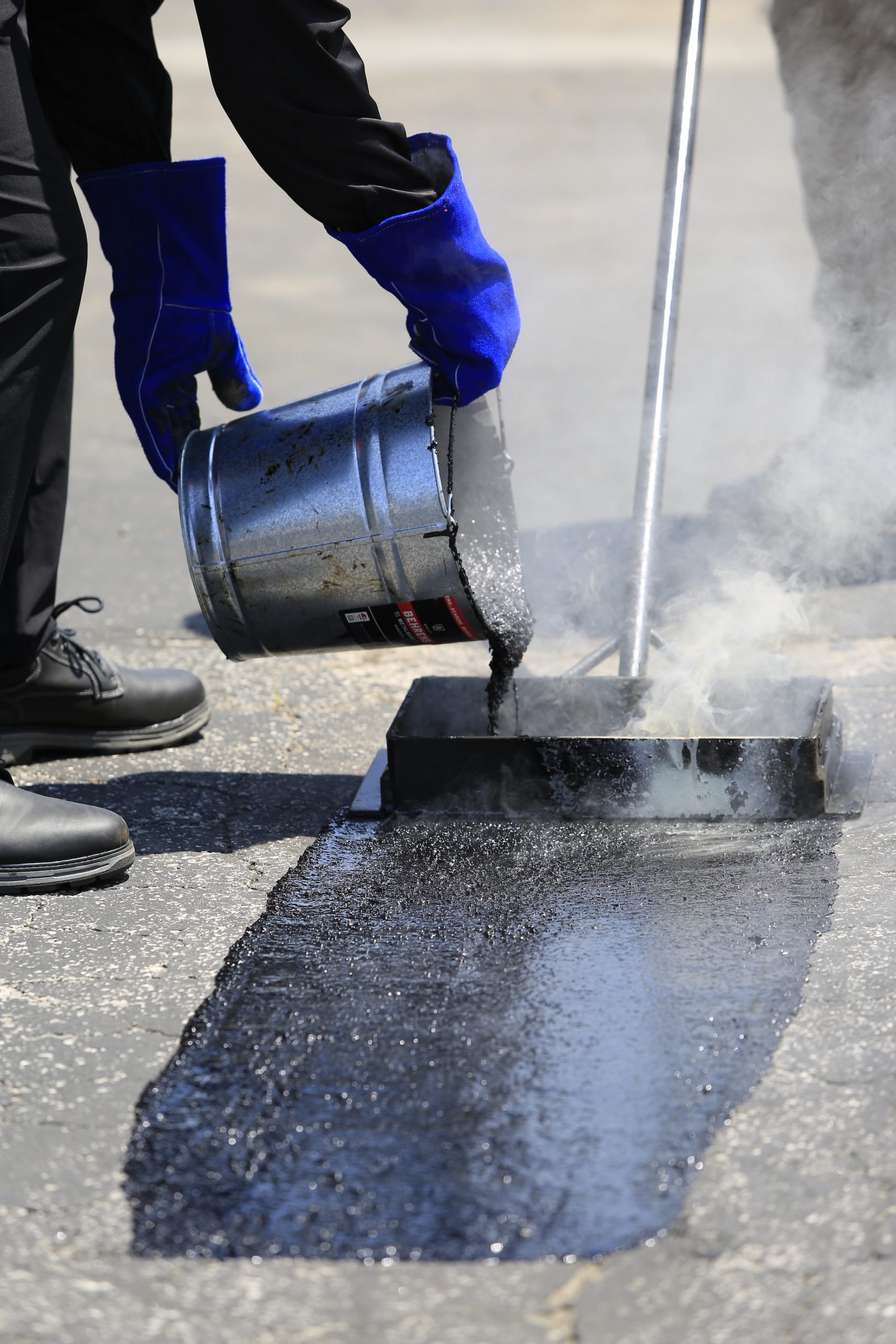 SealMaster mastic application to worn pavement. SealMaster mastic application to worn pavement.
