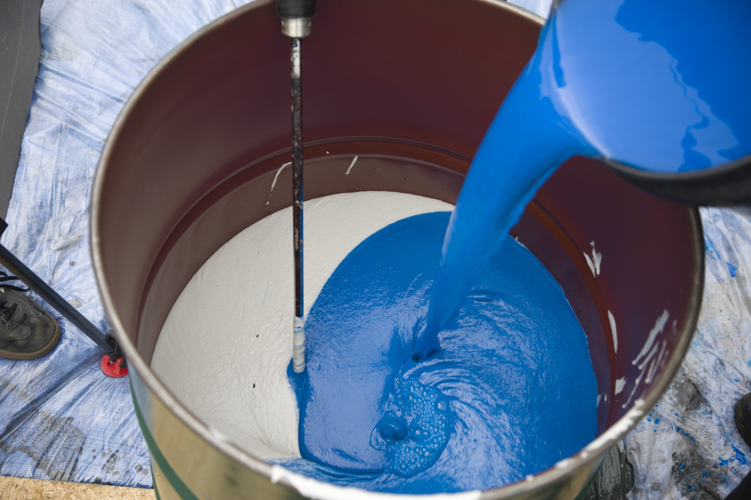Mixing SealMaster ColorPave colorized pavement sealer
